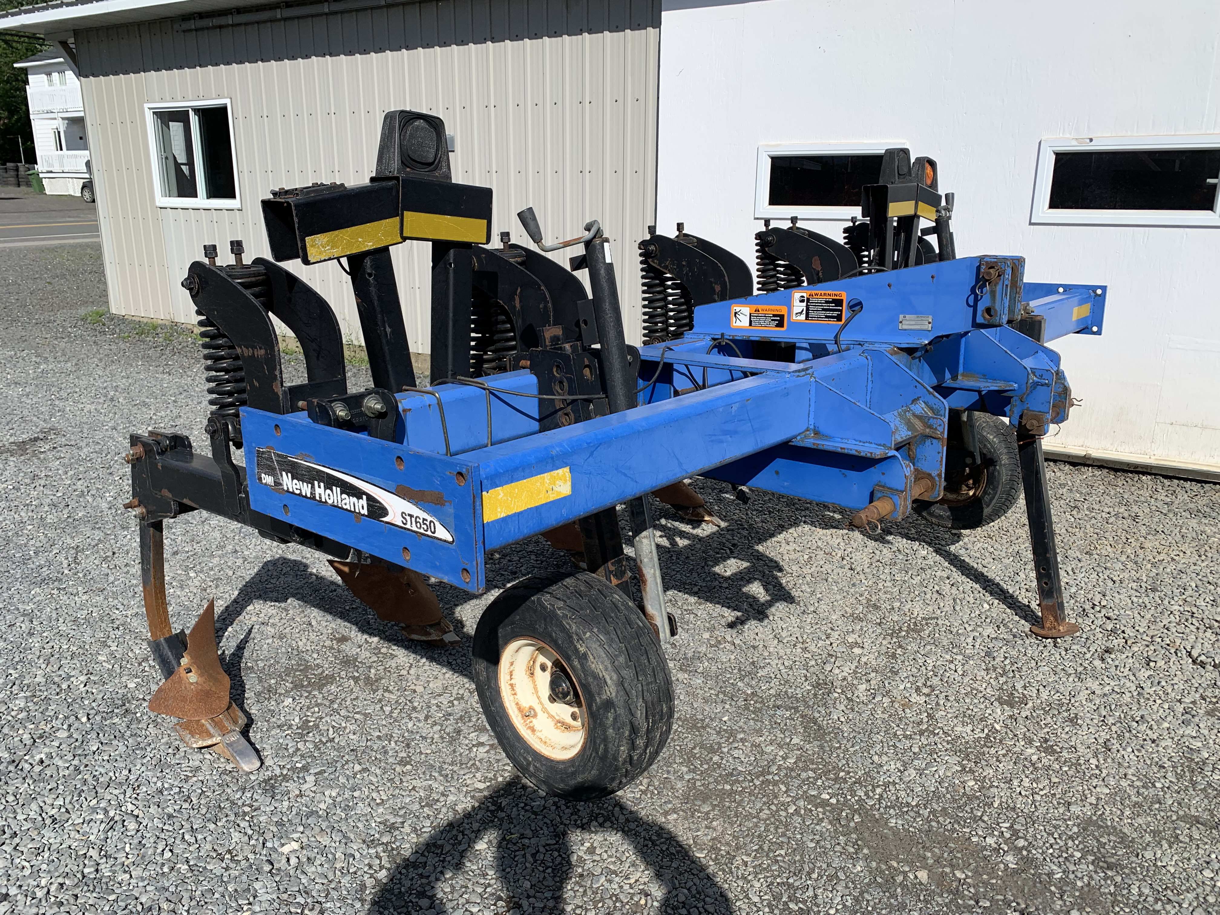  Sous-soleuse DMI New Holland ST 650, 5 pattes